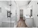 Well-lit bathroom with double vanity, walk in shower, and modern finishes at 1590 Highland Farm Dr, Suwanee, GA 30024