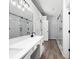 Bright bathroom featuring double vanity, glass enclosed shower, and sleek finishes at 1590 Highland Farm Dr, Suwanee, GA 30024