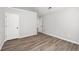Bedroom features white trim, natural light and luxury vinyl plank flooring at 1590 Highland Farm Dr, Suwanee, GA 30024