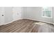 Bedroom with wood flooring and a window at 1590 Highland Farm Dr, Suwanee, GA 30024