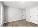 Bright bedroom with white trim, natural light and luxury vinyl plank flooring at 1590 Highland Farm Dr, Suwanee, GA 30024