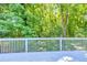 A gray painted deck area offers plenty of space for outdoor entertaining at 1590 Highland Farm Dr, Suwanee, GA 30024