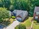 Well-maintained home with a two-car garage and lush landscaping at 1590 Highland Farm Dr, Suwanee, GA 30024