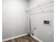 Laundry room features a shelf for storage and connections for a washer and dryer at 1590 Highland Farm Dr, Suwanee, GA 30024