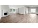 Large, open living room with fireplace, hardwood floors, lots of natural light and open design at 1590 Highland Farm Dr, Suwanee, GA 30024
