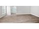 Main bedroom with luxury vinyl plank flooring and ensuite bathroom with shower at 1590 Highland Farm Dr, Suwanee, GA 30024