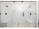 Luxurious bathroom with dual shower heads and a glass enclosed shower at 1590 Highland Farm Dr, Suwanee, GA 30024