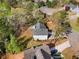 Aerial view of home showing the roof, deck, and surrounding landscape at 3407 Deerwood Ct, Rex, GA 30273