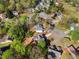 Birds eye view of home with a driveway on a tree-lined cul-de-sac at 3407 Deerwood Ct, Rex, GA 30273