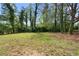 Large, grassy backyard offering plenty of space and privacy at 3407 Deerwood Ct, Rex, GA 30273