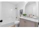 Bathroom featuring marble countertops, white cabinetry, and modern gold fixtures at 3407 Deerwood Ct, Rex, GA 30273