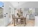 Bright dining room features a wood table and chairs, chandelier and a door to the outside at 3407 Deerwood Ct, Rex, GA 30273