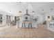 Bright kitchen with bar seating, stainless vent hood, and adjacent dining area at 3407 Deerwood Ct, Rex, GA 30273
