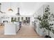 Modern kitchen with stainless appliances, island, and open layout to living spaces at 3407 Deerwood Ct, Rex, GA 30273