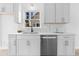 Modern kitchen with white cabinets, quartz countertops, and stainless appliances at 3407 Deerwood Ct, Rex, GA 30273