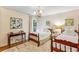 Comfortable bedroom with two beds, desk, and a soft rug at 4590 Lake Forrest Nw Dr, Atlanta, GA 30342