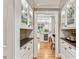 Butler's pantry with glass cabinets, counter space, and hardwood flooring at 4590 Lake Forrest Nw Dr, Atlanta, GA 30342