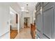 Welcoming foyer with marble floors, a vintage dresser, and an open view into the adjoining living spaces at 4590 Lake Forrest Nw Dr, Atlanta, GA 30342