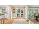 Bright hallway showcasing hardwood floors and an entryway to the kitchen and dining room at 4590 Lake Forrest Nw Dr, Atlanta, GA 30342