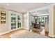 Bright hallway showcasing hardwood floors and an entryway to the dining room and kitchen at 4590 Lake Forrest Nw Dr, Atlanta, GA 30342