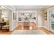 Charming kitchen featuring white cabinetry, center island, and seamless flow to adjacent spaces at 4590 Lake Forrest Nw Dr, Atlanta, GA 30342