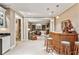 Open concept living room featuring neutral furniture and bamboo bar at 4590 Lake Forrest Nw Dr, Atlanta, GA 30342