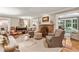 Cozy living room features a brick fireplace and an open floor plan at 4590 Lake Forrest Nw Dr, Atlanta, GA 30342