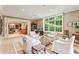 Open concept living room featuring neutral furniture and multiple seating areas at 4590 Lake Forrest Nw Dr, Atlanta, GA 30342