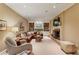 Cozy living room with a fireplace, built-in shelving, and comfortable seating at 4590 Lake Forrest Nw Dr, Atlanta, GA 30342