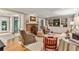 Cozy living room with fireplace, built-in shelving, and hardwood floors; perfect for entertaining and relaxation at 4590 Lake Forrest Nw Dr, Atlanta, GA 30342