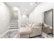 Finished basement area with staircase and cozy seating at 5649 Cobblestone Creek Pl # 13, Mableton, GA 30126