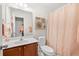 Well-lit bathroom featuring a single sink vanity and tub shower at 5649 Cobblestone Creek Pl # 13, Mableton, GA 30126