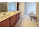 Spacious bathroom featuring double sinks, soaking tub, and a separate glass shower at 5649 Cobblestone Creek Pl # 13, Mableton, GA 30126
