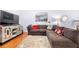 Cozy living room featuring a comfortable sectional sofa, entertainment center, and warm lighting at 5649 Cobblestone Creek Pl # 13, Mableton, GA 30126