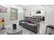Relaxing living area features gray leather seating, television, bar, and playful decor for ultimate entertainment at 5649 Cobblestone Creek Pl # 13, Mableton, GA 30126