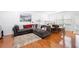 Comfortable living room with hardwood floors, ample seating, and natural light at 5649 Cobblestone Creek Pl # 13, Mableton, GA 30126