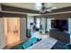 View of the owner's suite, which has a ceiling fan, large windows, and a private bathroom at 5649 Cobblestone Creek Pl # 13, Mableton, GA 30126