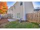 View of the home's fenced-in backyard, including a concrete patio area at 840 Ash St, Canton, GA 30114