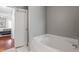 Cozy bathroom featuring a standalone tub and easy access to the bedroom at 840 Ash St, Canton, GA 30114
