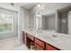 Bathroom with double sinks, white countertops, and a large mirror at 840 Ash St, Canton, GA 30114