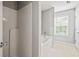 Clean bathroom featuring a shower, tub, and a window for natural light at 840 Ash St, Canton, GA 30114