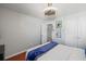Bedroom features hardwood floors, a modern ceiling fan, and ample closet space at 840 Ash St, Canton, GA 30114