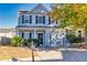 Beautiful two-story home with gray siding, black shutters, well-kept landscaping, and attached garage at 840 Ash St, Canton, GA 30114