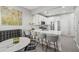 Modern kitchen features stainless steel appliances, quartz countertops, and adjacent dining space with breakfast bar at 840 Ash St, Canton, GA 30114
