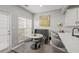 Bright kitchen featuring stainless steel appliances, white cabinets, quartz counters, and an adjacent dining area at 840 Ash St, Canton, GA 30114