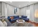 Living room is bright and inviting, with a comfortable sofa and stylish decor elements at 840 Ash St, Canton, GA 30114
