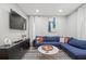 Living room features a comfortable sofa, modern decor, and plenty of natural light at 840 Ash St, Canton, GA 30114
