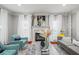 Inviting living area featuring a fireplace, plush seating, and decorative elements at 840 Ash St, Canton, GA 30114