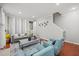 Comfortable living room with a modern sofa, stylish accents, and staircase access at 840 Ash St, Canton, GA 30114