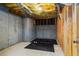Unfinished basement featuring an workout area with weights and a rubber floor at 138 Grand Ave, Suwanee, GA 30024